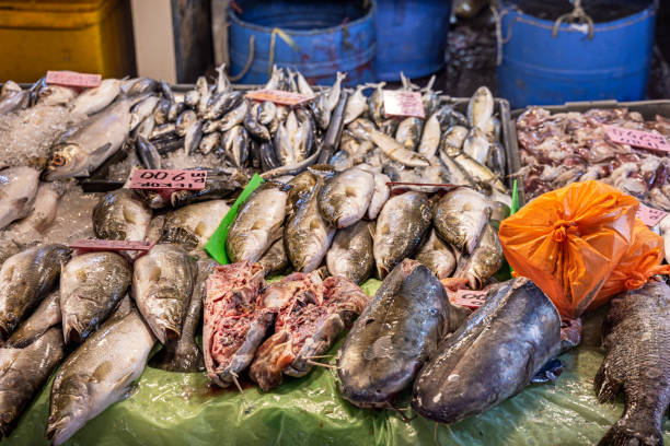 Different kinds of fish put up for sale at a market stall in the central Chow Kit market in the center of the Malaysian capital Kuala Lumpur