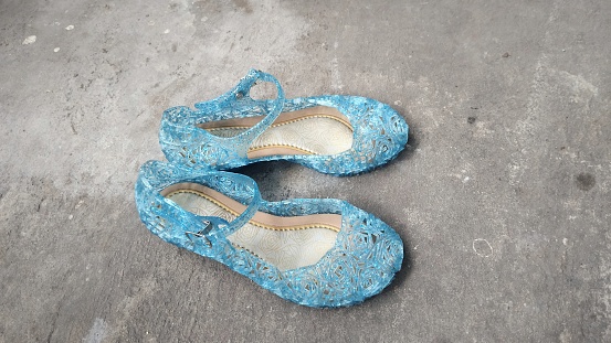 A pair of blue jelly shoes. Cute children's shoes
