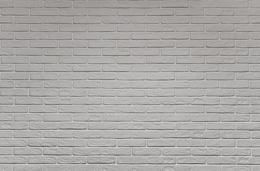 a white brick wall. the background is textured
