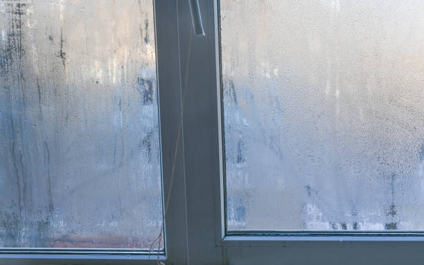 istock a wet fogged window. condensation on the glass. 2065313282