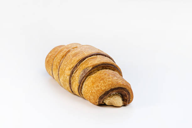 istock Fresh chocolate croissant with nut mousse on white isolated background 2065321790