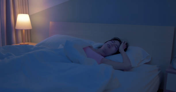 istock asian woman sleepless at night 2065322344
