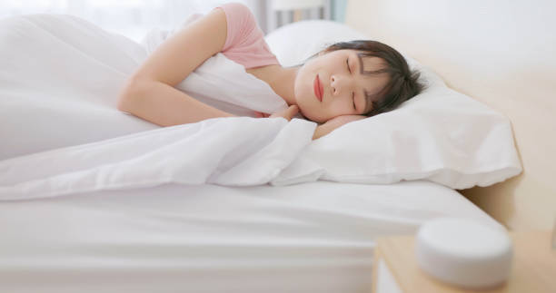 istock asian woman use smartphone alarm 2065322365
