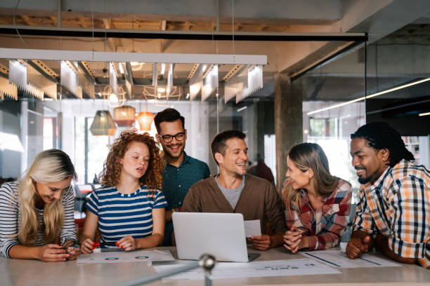 istock Group of young multi-ethnic startup business team collaborating on project in modern office 2065323994