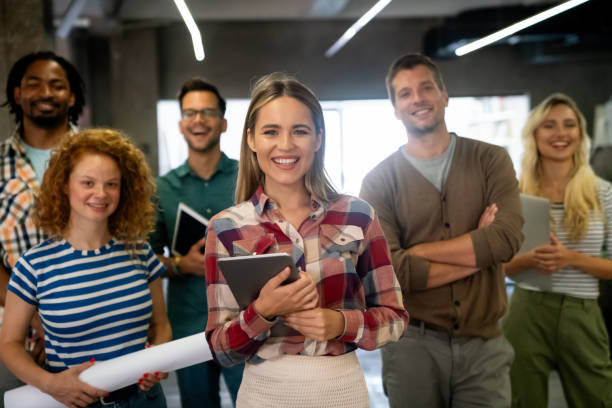 istock Group of young multi-ethnic startup business team collaborating on project in modern office 2065327759