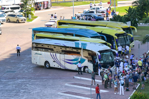 Puerto Vallarta, Jalisco, Mexico - 15 January 2024: Passengers from a cruise ship waiting to board coaches for a trip.