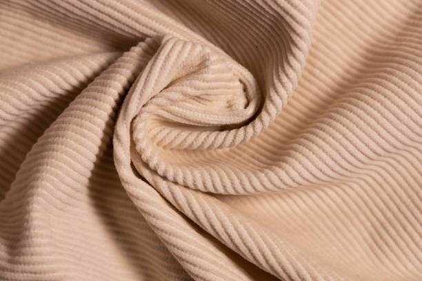 istock Velvety fabric texture pattern. Texture of velvet textile nude color. 2065333662