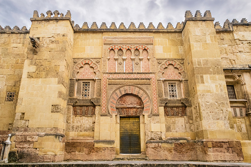 Architectural features on the facade of the Mosque–Cathedral of Córdoba, the city's cathedral, but, due to its status as a former mosque, constructed in 785, also known as the Great Mosque of Córdoba