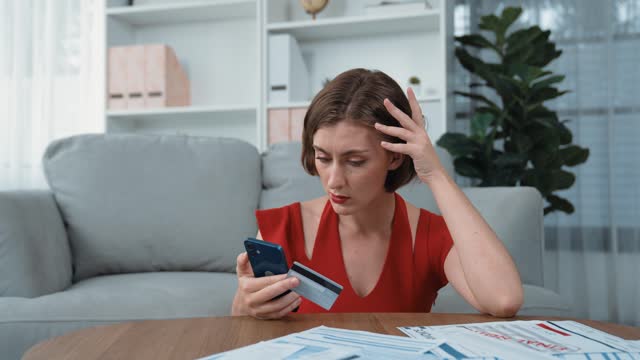 Stressed young woman has financial problems credit card debt to pay. Prim