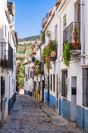 Cobblestone alley in the old town of Granada, one of the most beautiful cities in Andalusia