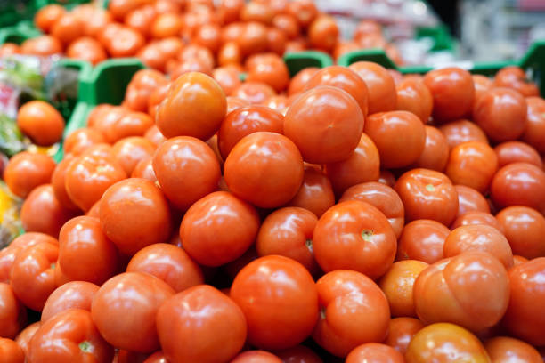 Many small thai tomatoes at market stall
