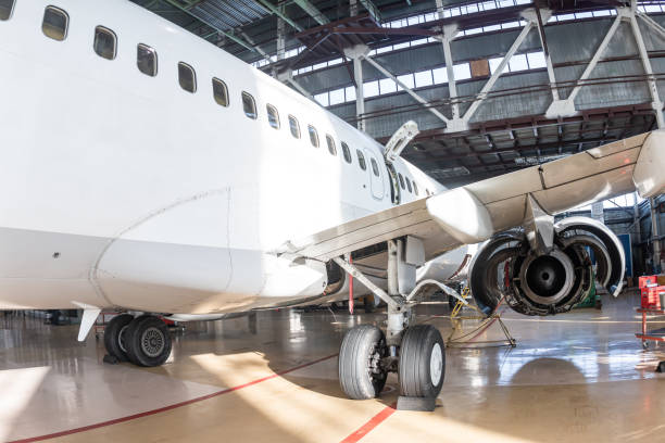 istock White passenger jetliner in the aviation hangar 2065382469