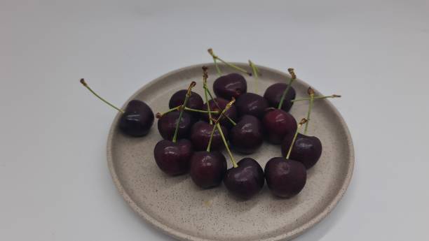 istock Tasmanian Cherry fruit served in a small plate, isolated on white background. 2065382807