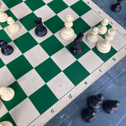 High angle view of plastic chess table  with game pieces