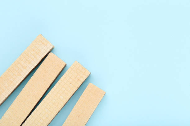 istock Sweet wafer sticks on blue background 2065411987