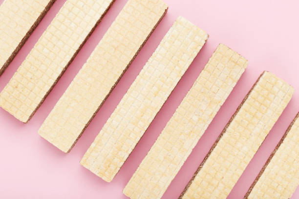 istock Sweet wafer sticks on pink background 2065412531