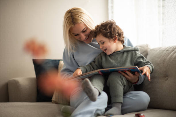 istock Mom reads to her son 2065413074