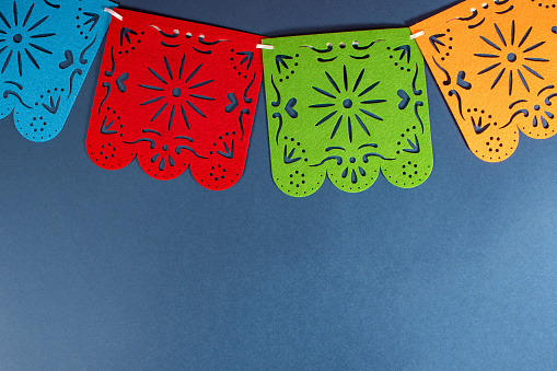 Mexican paper garlands decorating. Cinco De Mayo colorful traditional picado banner festive.