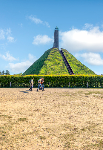 Tourist people visiting he 36-meter-high Pyramid of Austerlitz, built in 1804 by Napoleon's soldiers, is an honorary monument in the Netherlands at Utrechtse Heuvelru, offering a picturesque view on sunny spring days.