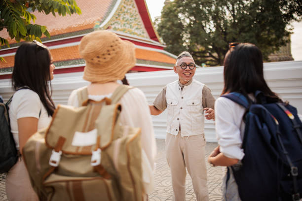 istock Tourist guide talking to women tourists 2065479036