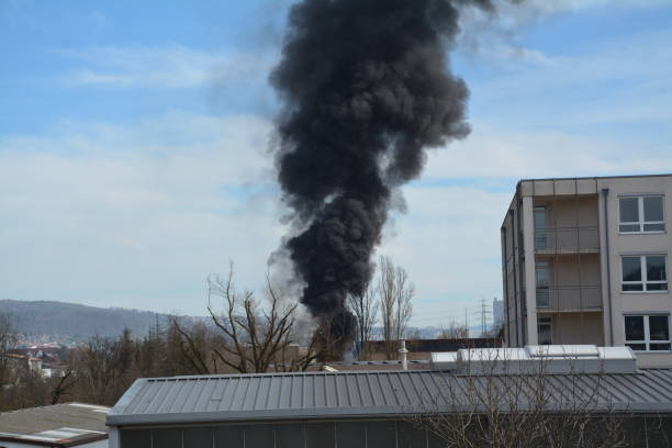 istock Large black cloud of smoke caused by a fire 2065488271