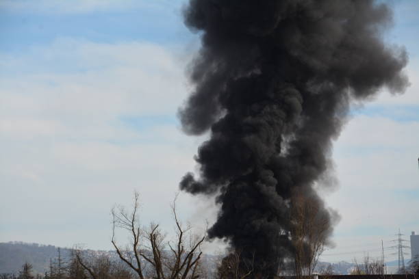 istock Large black cloud of smoke caused by a fire 2065488815