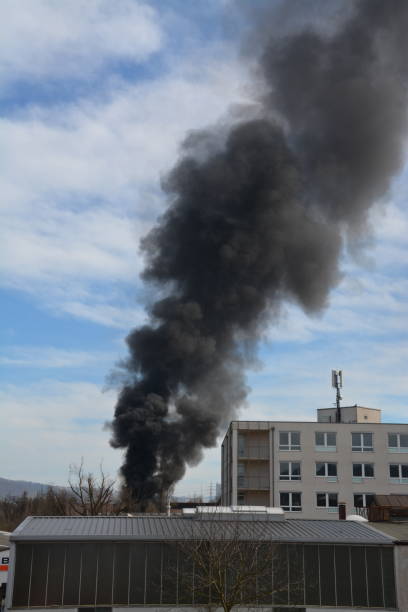 istock Large black cloud of smoke caused by a fire 2065489343