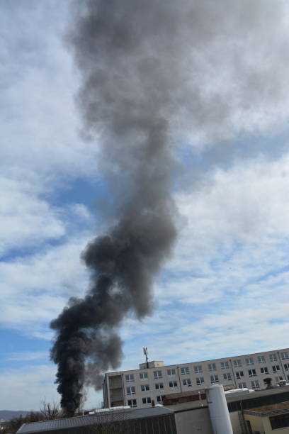 istock Large black cloud of smoke caused by a fire 2065489346