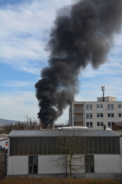 istock Large black cloud of smoke caused by a fire 2065489355