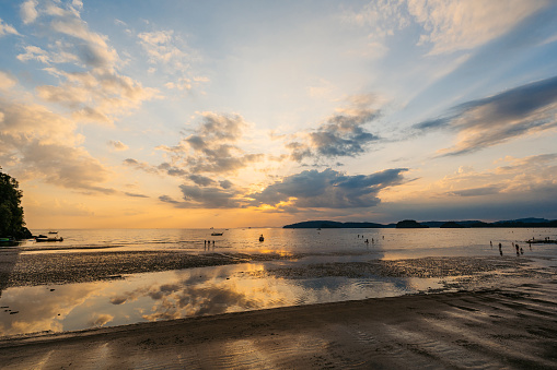 Beautiful sunset on the Ao Nang beach on the Andaman sea in Thailand.