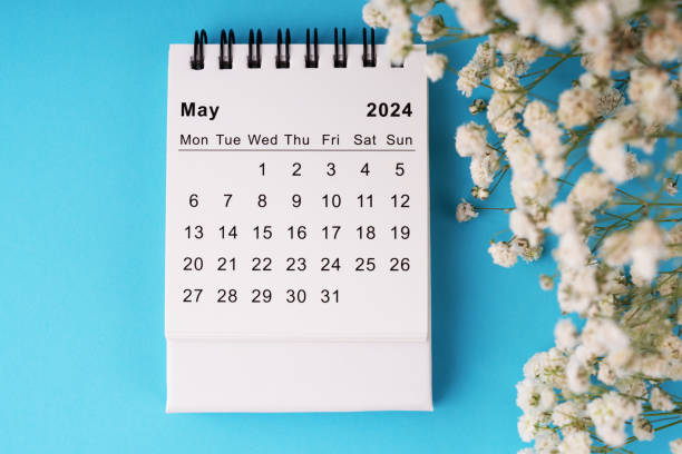 istock May 2024 calendar flat lay on blue background 2065498542