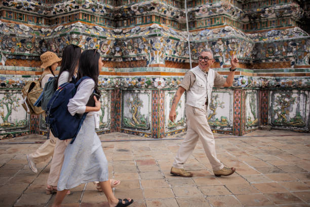 Private tourist guide explaining the city history to women tourists.
