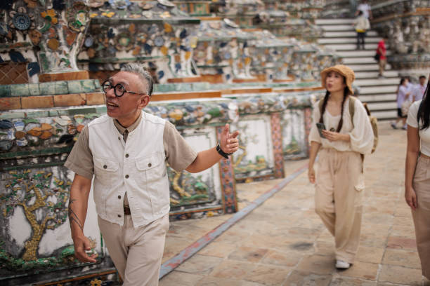 Private tourist guide explaining the city history to women tourists.