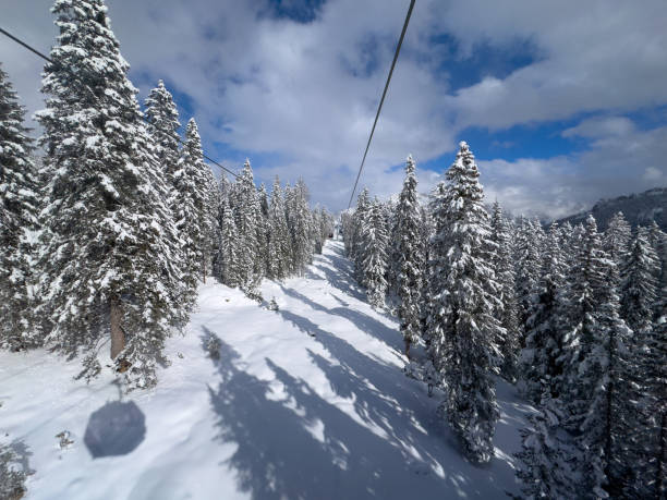 Brunico, Italy – December 14, 2022: A landscape of a ropeway on Kronplatz covered in snow during the sunrise