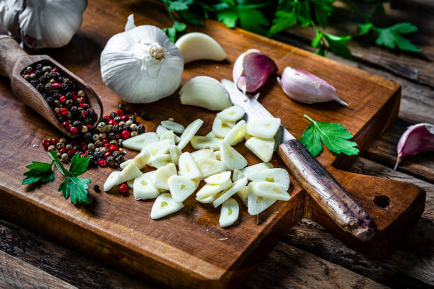 istock Chopped garlic on wooden cutting board 2065527524