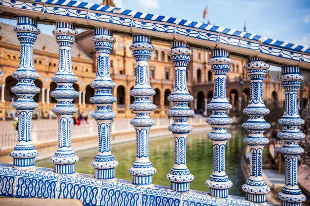 Photo of Close up of spanish tiles on handrail at Plaza de Espana, Seville, Spain
