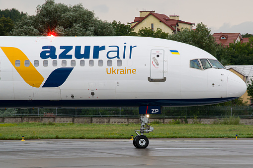 Ukrainian airline's Azur Air Ukraine Boeing 757-300 close-up while taxiing for takeoff in Lviv Airport
