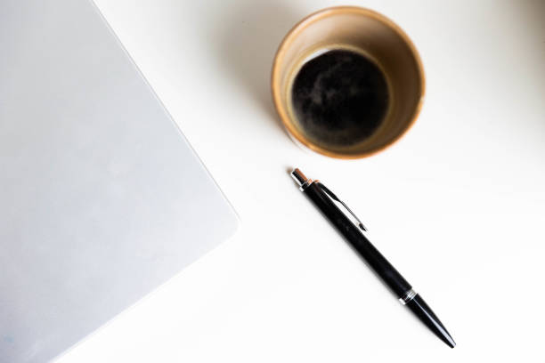siness Day with pencil, laptop and black coffee