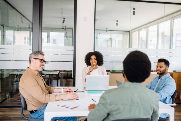 istock A diverse group of professionals collaborates in a modern office space 2065627412