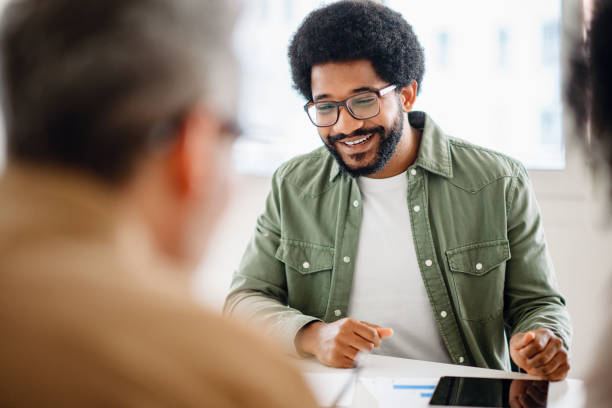 Colleagues engage in a lively exchange of ideas in an office