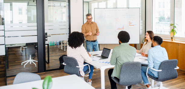 Colleagues engage in a lively exchange of ideas in an office