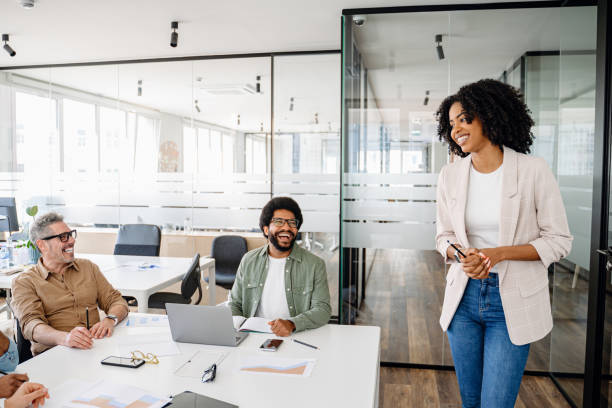 istock Colleagues engage in a lively exchange of ideas in an office 2065627442