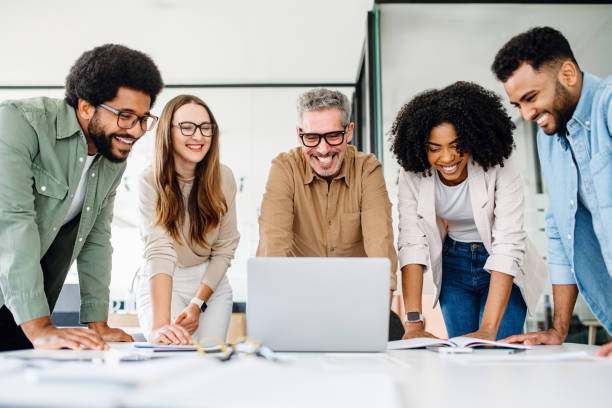 istock Colleagues engage in a lively exchange of ideas in an office 2065627457