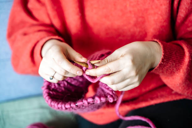 istock Knitting from wool. Home hobby in winter. Knitting warm winter clothes 2065628536