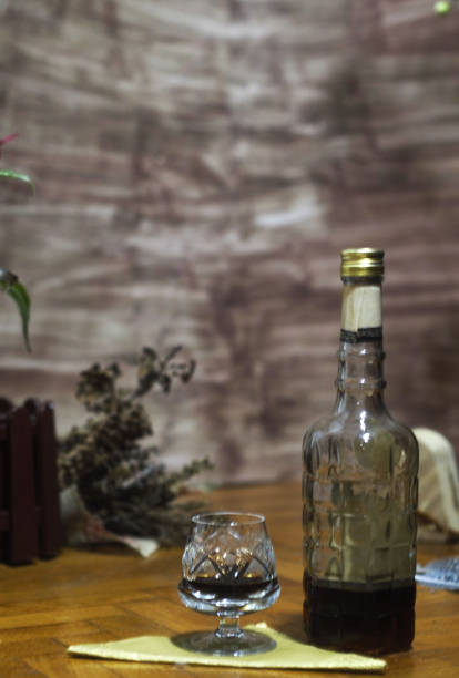 istock Bottle and glass of strong drink in a relaxing environment 2065647112