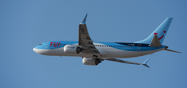 Tenerife, Spain February 14 st, 2024. Boeing 737 MAX 8 TUI Airlines flies in the blue sky. Takeoff at Tenerife Airport