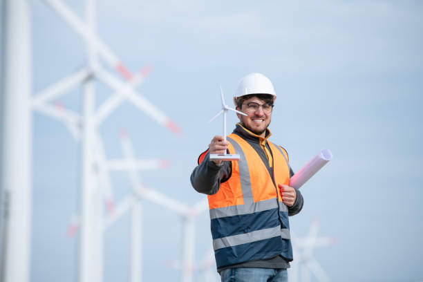 istock Portrait of smiling power engineer at a wind power station. 2065668729