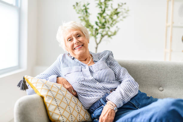 istock Smiling mature grey senior woman looking at camera 2065672704