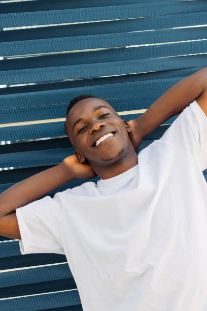 istock Close up handsome man laughing with hands behind head 2065688979