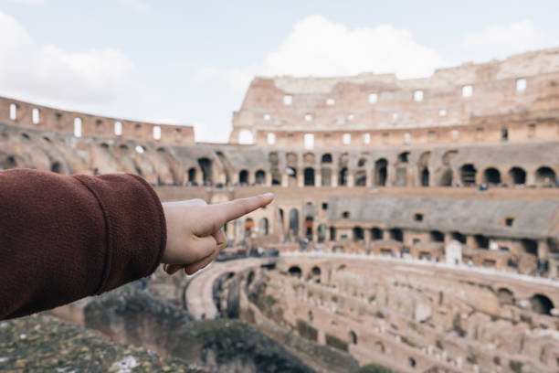 istock A person pointing at a large building 2065695741